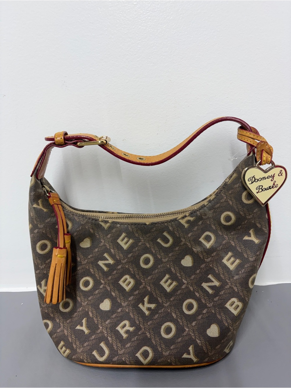 Dooney & Bourke Brown Logo Hobo with Tassel and Heart Charm
